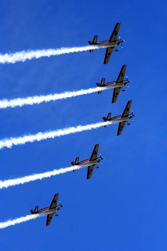 Five Chilean Air Force aerobatic planes trailing smoke