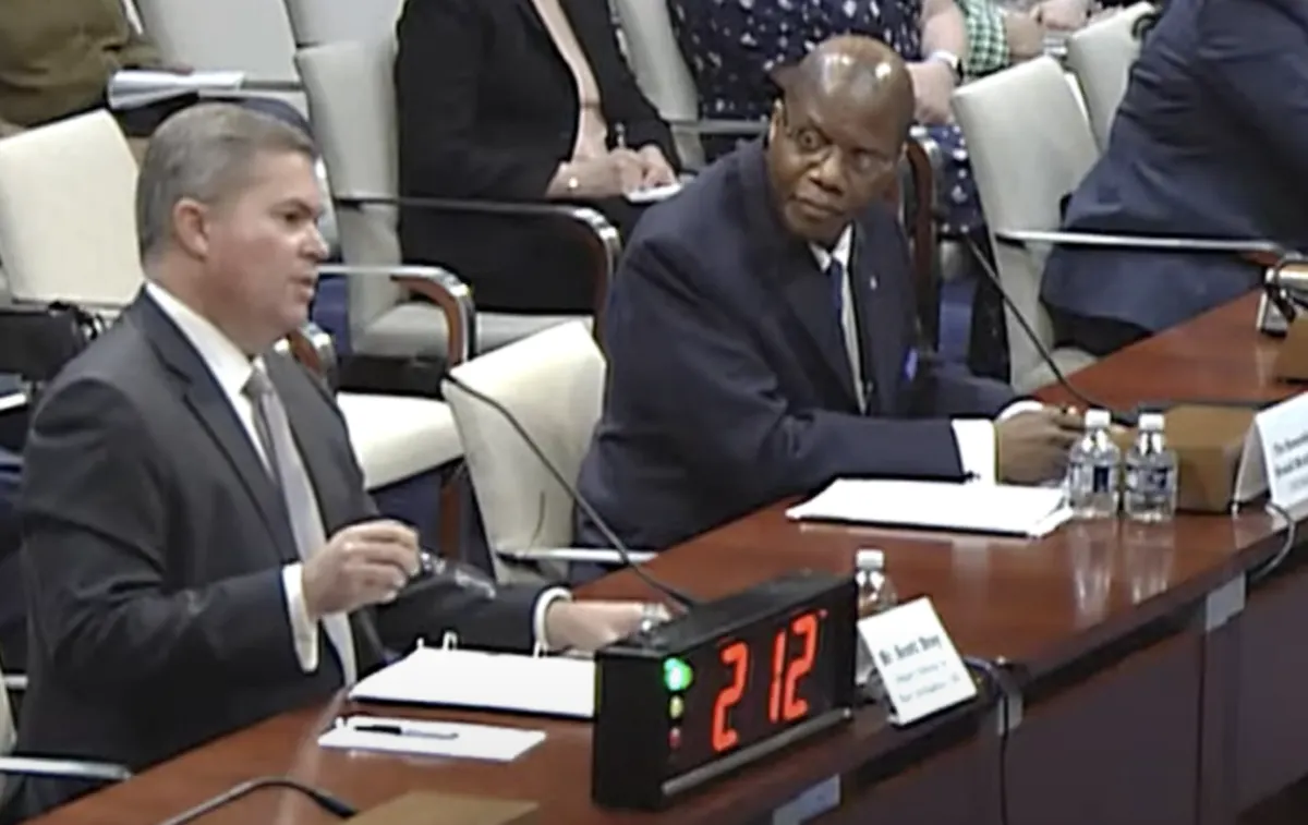 Scott Bray and Ronald Moultrie at the witness table